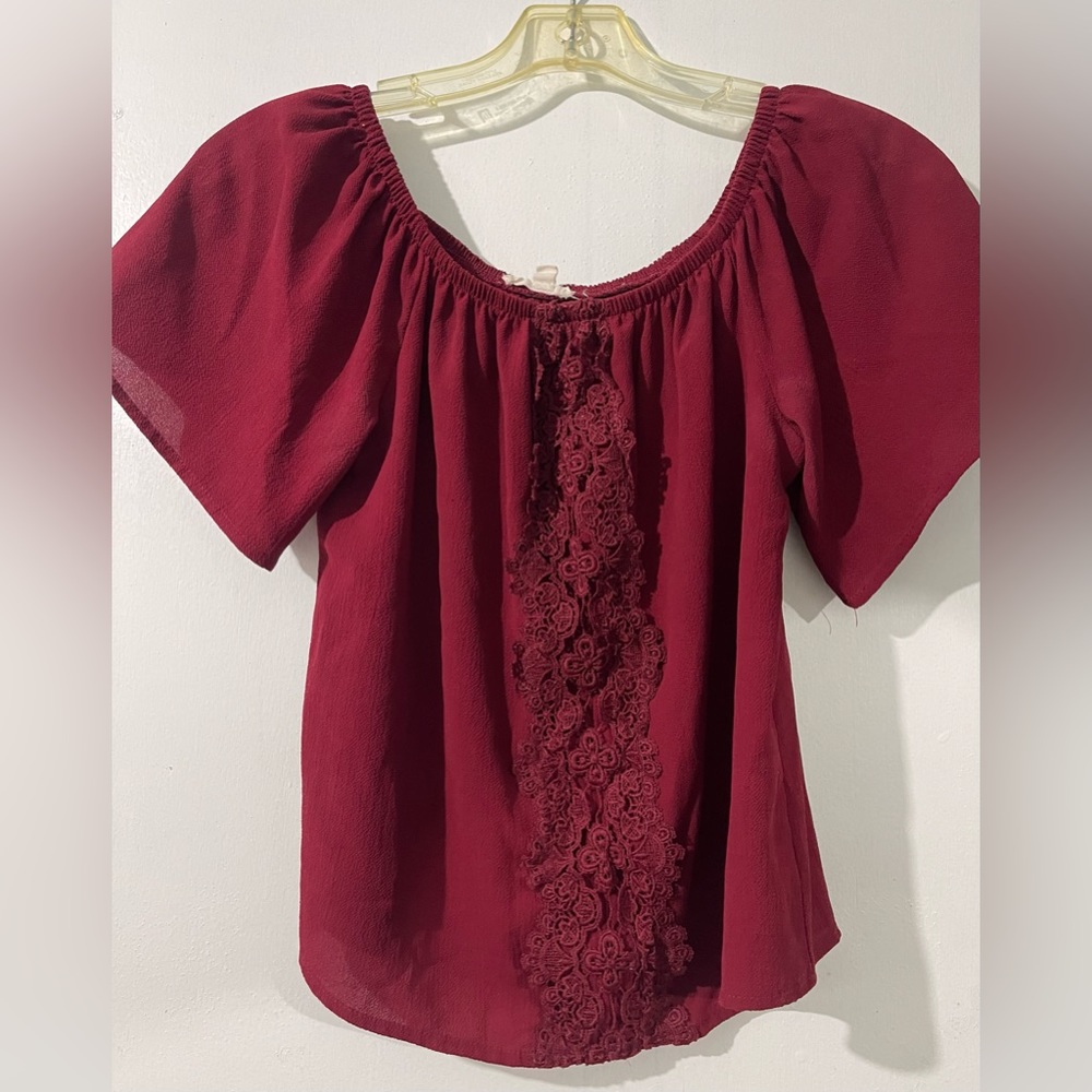 Dark red blouse.